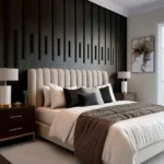 Black accent wall bedroom for couples with a cream upholstered bed, dark wood nightstands, and a neutral rug