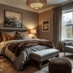 Calming bedroom with warm brown walls, layered lighting, comfortable neutral bedding, and a chair beside the window