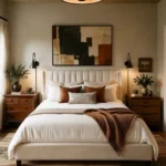 Couples bedroom blending traditional and modern styles with different walnut nightstands, black lighting, and contemporary art