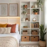 Small modern bedroom with tall wall shelving, storage baskets, plants, and wall-mounted bedside lighting