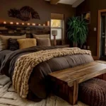 Warm bedroom for couples with soft layered bedding, candlelight, a wood bench, and autumn views