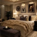 Warm modern bedroom with a ceiling fixture, recessed lighting, picture lights, and bedside lamps