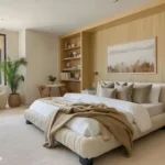 Warm modern bedroom with a low upholstered bed, built-in shelves, a curved chair, and open walking space around the furniture