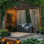 backyard ideas patio area with pergola outdoor sofa lanterns string lights curtains