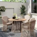 backyard patio with a dinette set with chairs round table area rug underneath