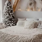 bedroom decorated for christmas with flocked christmas tree in corner