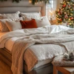 christmas decorated bedroom with garland above headboard and christmas tree in the corner