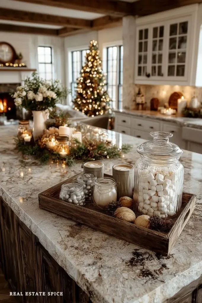 christmas decorated kitchen island with mugs of cocoa chocolate and christmas decor on a tray