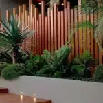 different sized wood slates used for privacy fence at house