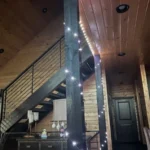 fairy lights wrapped around beams in living room