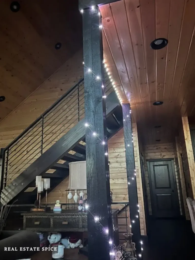 fairy lights wrapped around beams in living room