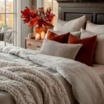 fall bedroom with maple branches in vase on nightstand
