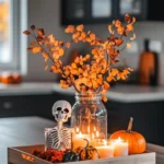 fall decor on tray with small skeleton figure candles small pumpkin copyright Real Estate Spice