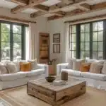 farmhouse living room with neutral colors exposed wood beams wood accents and natural elements