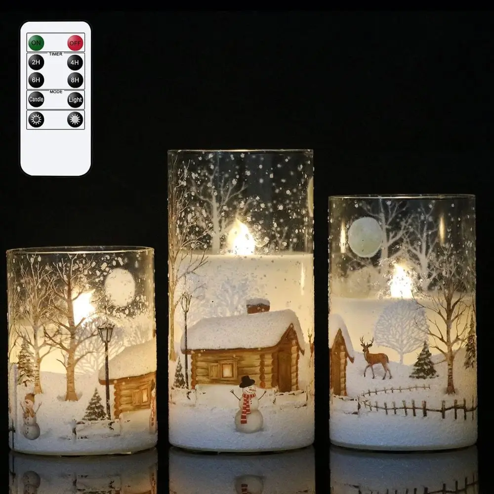 frosted glass winter decorated candles with snowman deer cabin with snow pine trees shows remote for flameless candles
