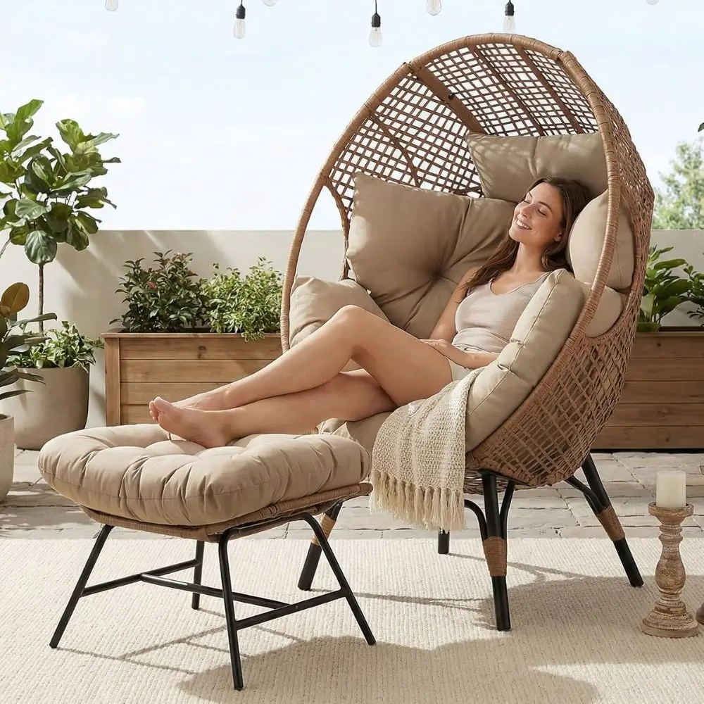 large egg chair lounger with cushions and foot rest