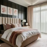 Modern bedroom with a black paneled wall, beige upholstered bed, blush bedding, wood nightstands, and floor-to-ceiling curtains