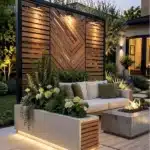 modern patio with tall privacy screen and potted greenery on the side