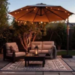 outdoor patio with outdoor chairs coffee table outdoor run under a patio umbrella with string lights