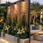 patio rule of 3 privacy has privacy screen tall plants and greenery in front and lighting along the bottom