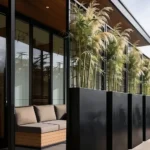 patio with tall planters and greenery used for privacy