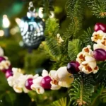 popcorn and cranberries strung together on christmas tree