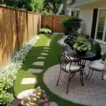 small backyard design with garden landscaping and small table with chairs