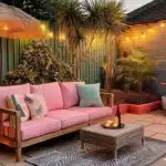 small backyard patio with outdoor sofa table and outdoor rug