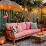 small patio with outdoor bench string lights outdoor small table and rug