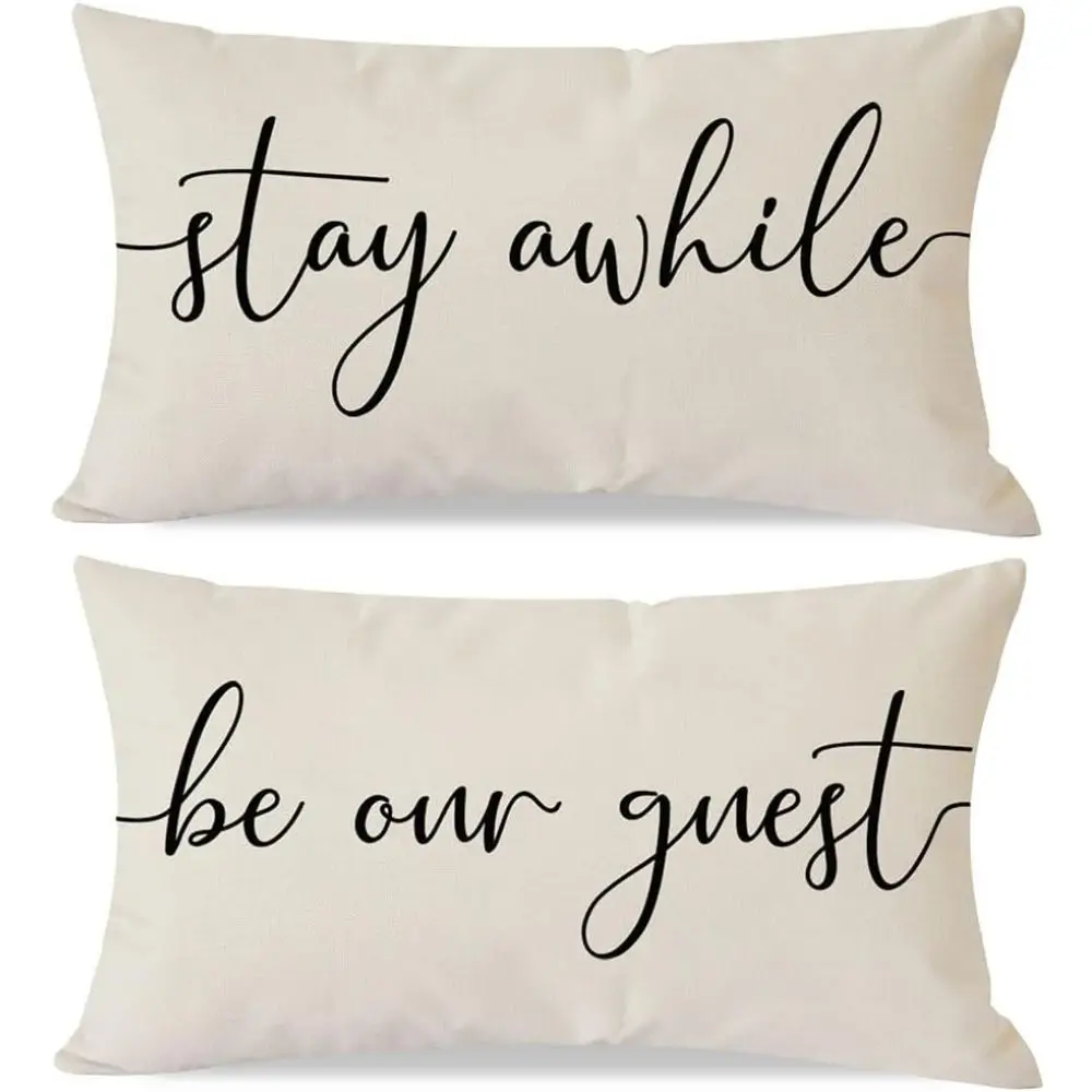 throw pillows one says be our guest one says stay awhile