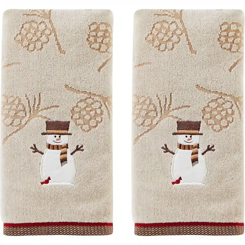 towels with snowmen and pine cones on them
