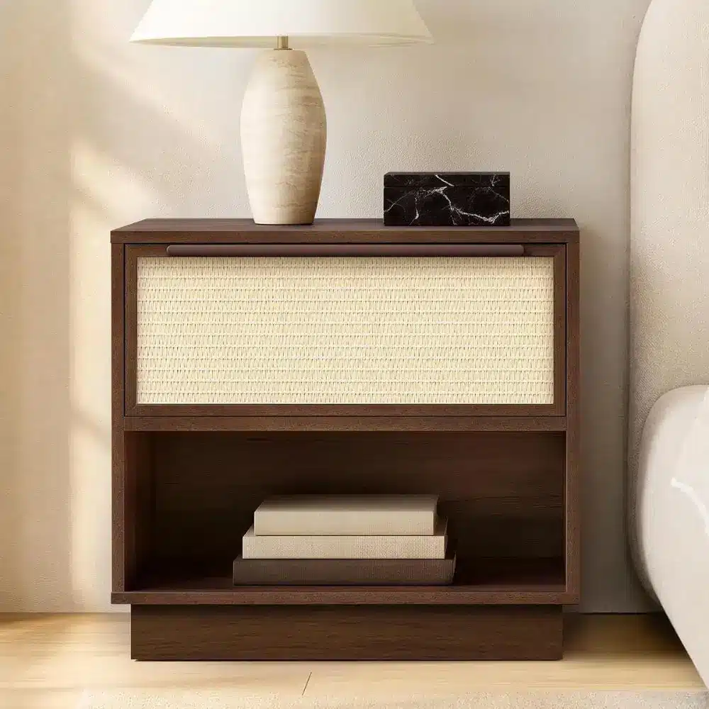 walnut nightstand with rattan drawer next to bed