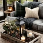 winter decorated living room with tray with tea lights pinecones and greenery a small lantern