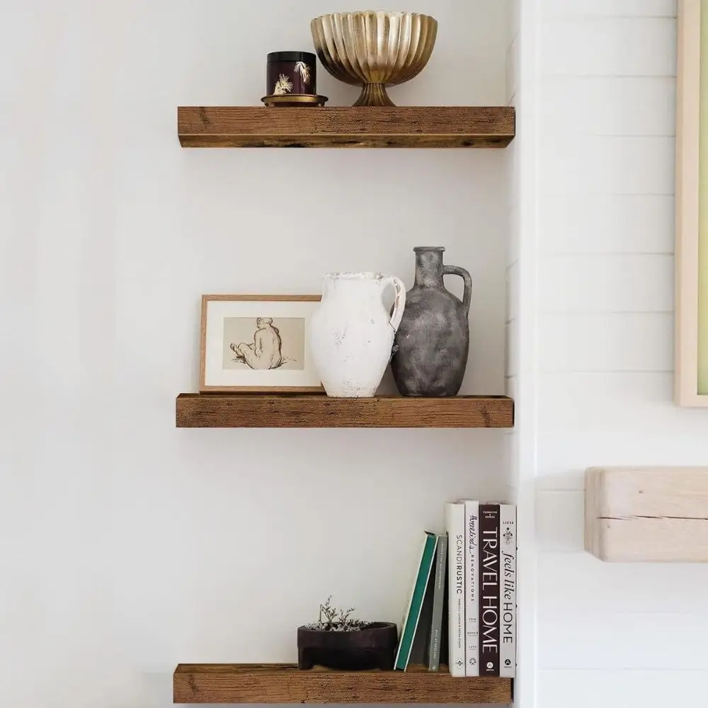 wood floating shelves with home decor on them